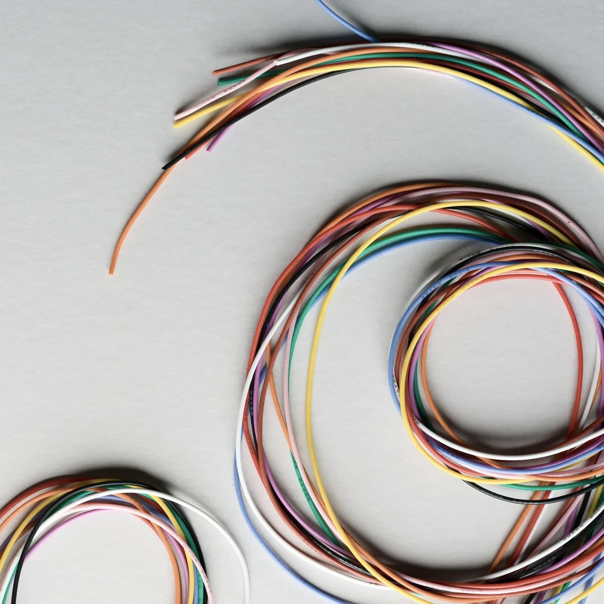 Coils of coloured wire prepared for harness assembly